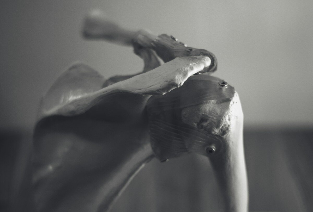 gray concrete horse figurine on white table