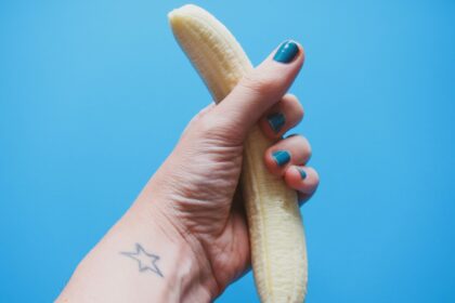 person holding peeled banana fruit