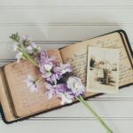 purple flowers on brown open book