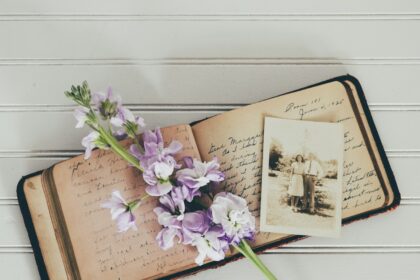 purple flowers on brown open book